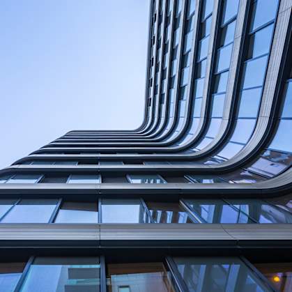 close up of the side of a tall building with a sky background