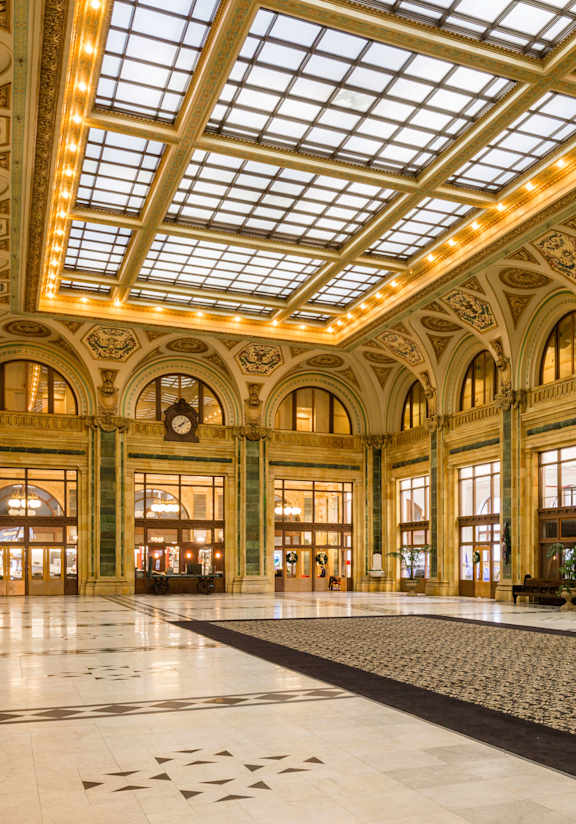 A large, ornate room with a high ceiling and a marble floor at The Pennsylvanian Apartments, Pittsburgh, Pennsylvania