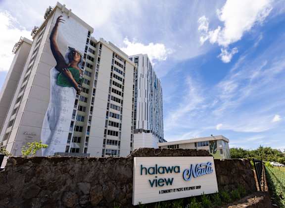 A sign that says "Halawa View" is in front of a building.