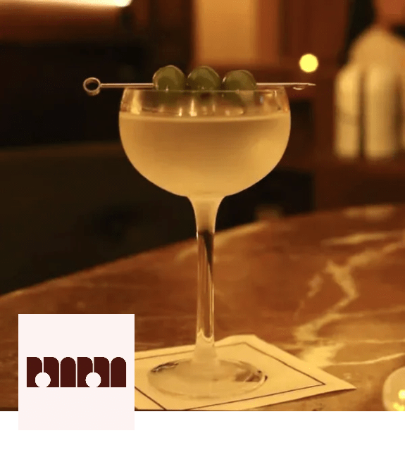 A cocktail glass with a garnish on top of it. at Citizen on Jasper, Edmonton, AB, T5K 0M5