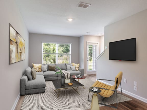 a living room with a couch and a tv