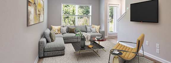 a living room with a couch and a tv