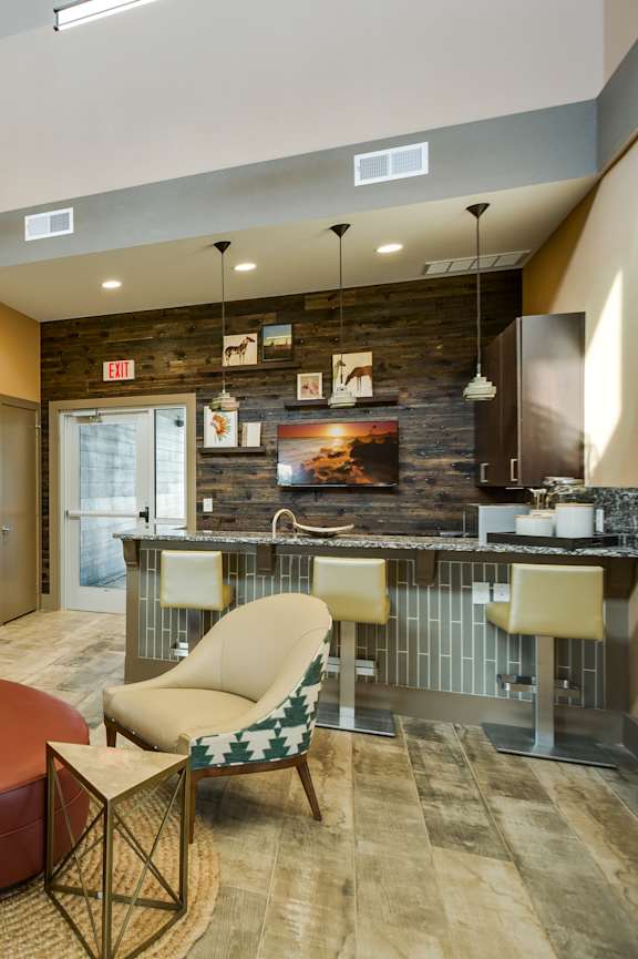 A reception area with a piano and chairs.