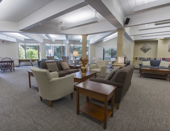 a large lobby with couches and chairs and tables