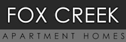 The Carriages Apartment Homes logo.