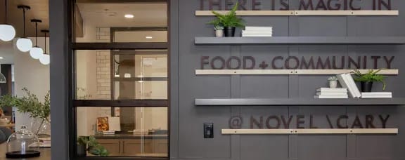 the facade of a food and community store with glass windows