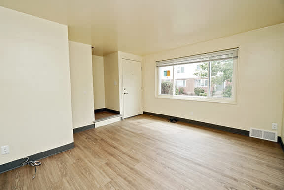 Oxford Village Townhomes – Living Room – Amherst Area – Appliances Included - 24 Hour Emergency Maintenance – Carpeting – Storage – Ask for a Tour -- Internet and Cable Ready - Affordable - Remolded –