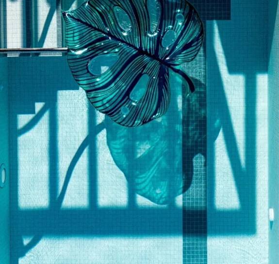 A blue and white striped object is hanging on a wall.