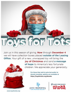 a poster for toys for tots showing a man in a santa hat and