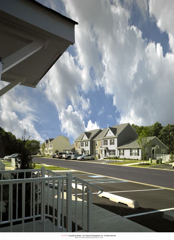 a rendering of a neighborhood with houses on a street
