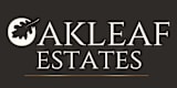 The image is a logo for a company named Oakleaf Estates.