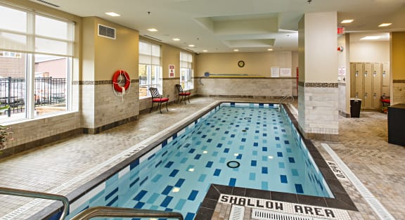 A swimming pool with a blue tile floor 