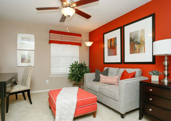 a living room with white walls and a wooden table