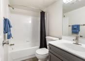 Thumbnail 6 of 9 - a bathroom with a sink toilet and a shower at Copper and Quarry Village, Pikesville, Maryland