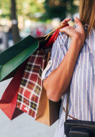 a woman holding a bunch of shopping bags at Madison Sierra Sun, Washington, 98374