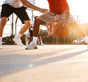 Two men playing basketball at Victory Northgate Apartments, Seattle, WA, 98125