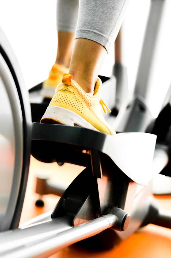A person is exercising on a stationary bike.