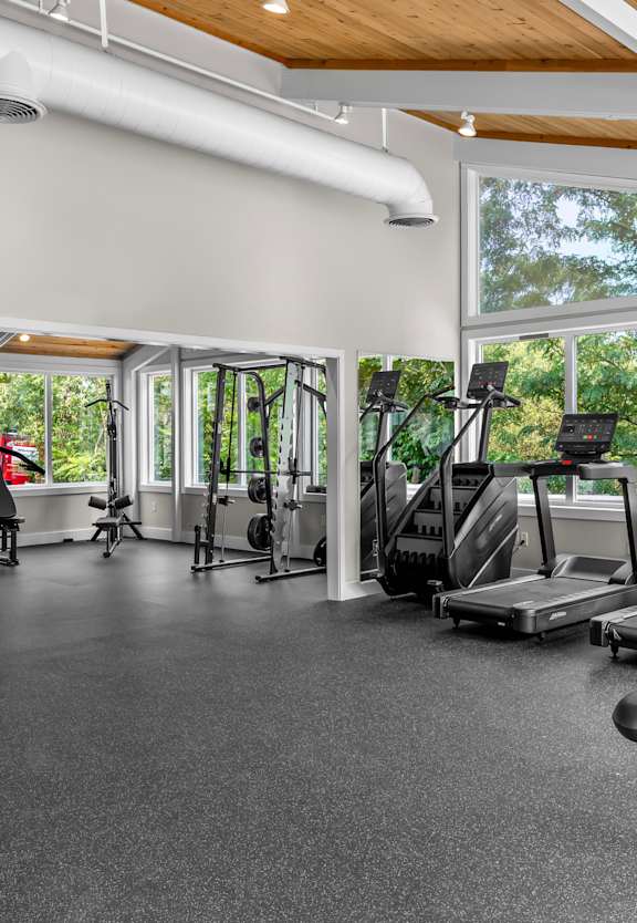 a large exercise room with treadmills and elliptical trainers at Highlands at Faxon Woods, Quincy, MA, 02169