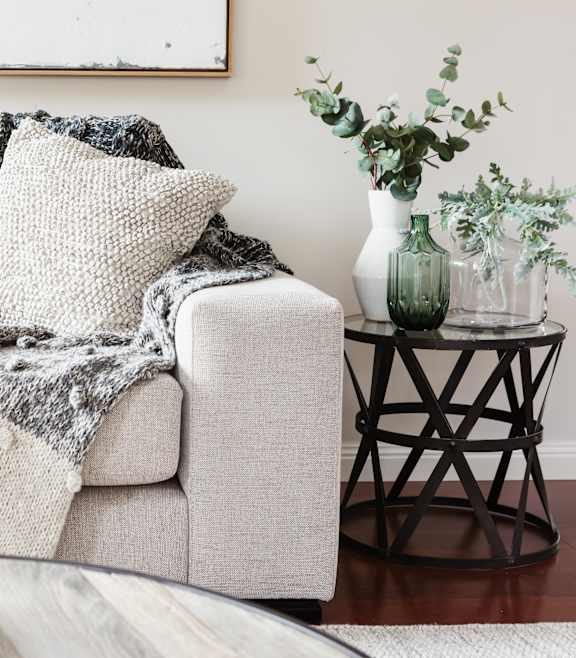 a living room with a couch and a blanket on it