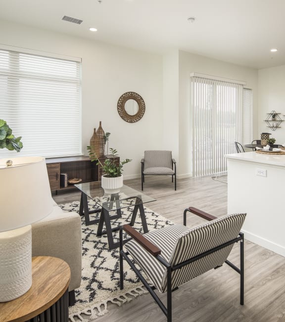 a living room with a kitchen and a dining room