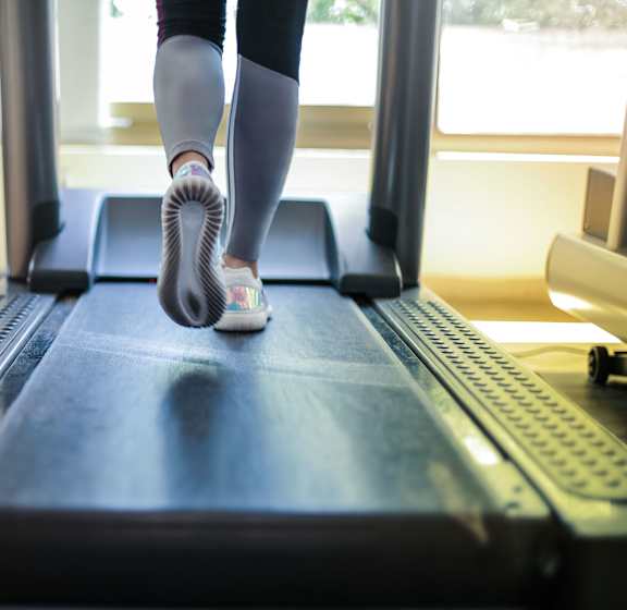 A person is running on a treadmill.