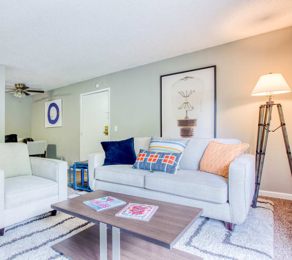 a living room with two couches and a coffee table at The Grove Brentwood in Nashville, TN