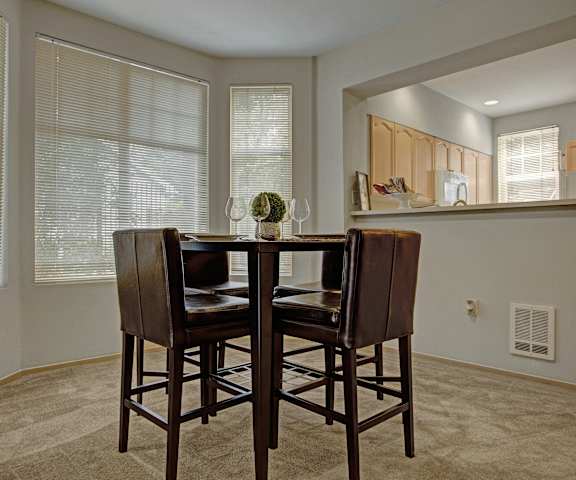 A kitchen with granite counter tops and stainless-steel appliances at Aspen Creek. 