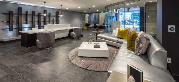 topaz leasing lobby with lounge sofa and glass entry way at Topaz Apartments, Los Angeles, CA, 90013