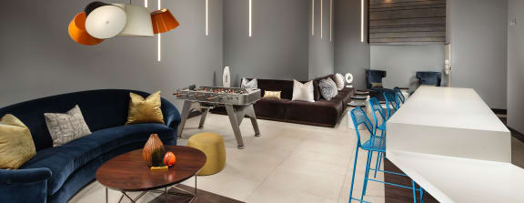 topaz clubroom with fooseball table at Topaz Apartments, Los Angeles, CA, 90013
