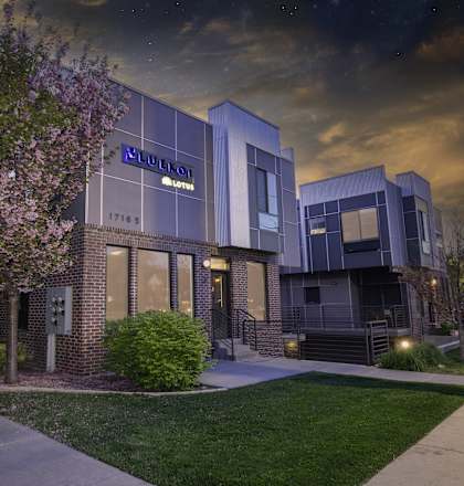 the building where the hotel is located is lit up at night