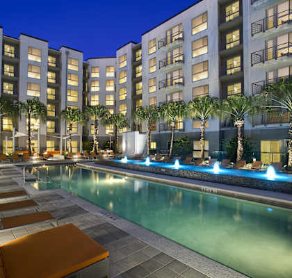 a swimming pool at night at the grove resort and spa