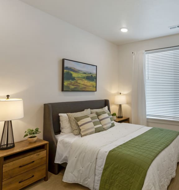 Comfy Bedroom with a Big Window at Ridge View Apartments, WY, 82007