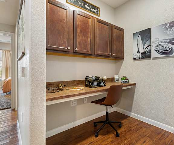 a home office with a desk and cabinets at The Fairways at Star Ranch, Hutto, Texas