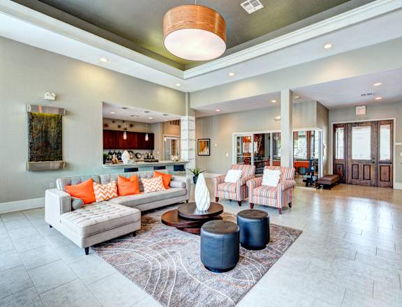 a large living room with couches and a table