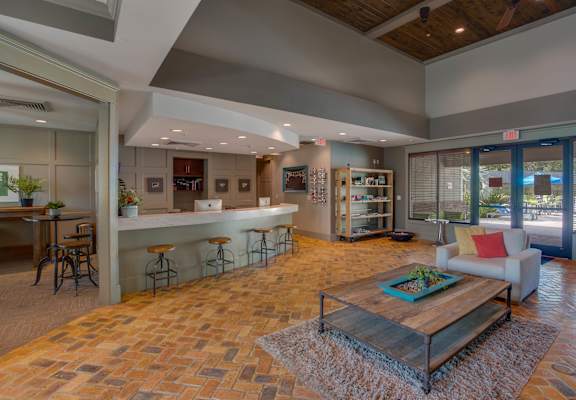 A living room with a tile floor and a couch.