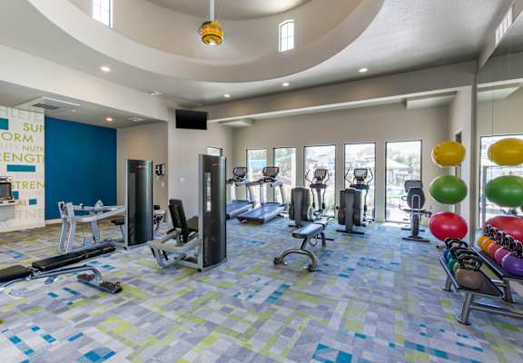 a spacious fitness center with treadmills and other exercise equipment at Trevi Apartment Homes, Arizona, 85224