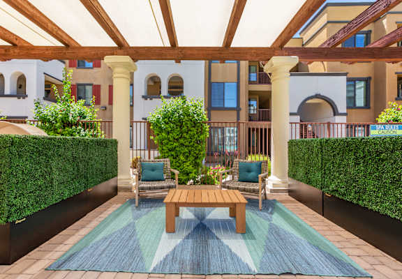 a patio with a table and two chairs at Trevi Apartment Homes, Arizona, 85224