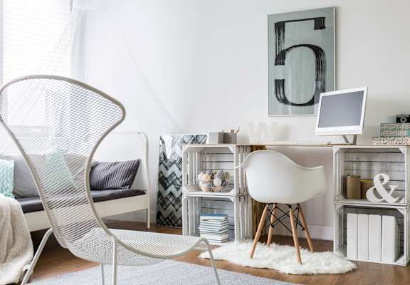 a home office with a desk and chair