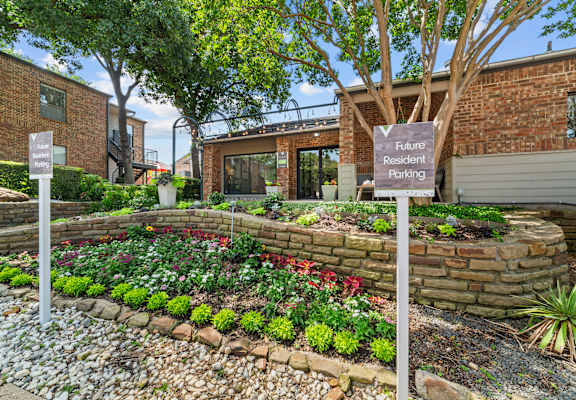 A garden with a sign that says "Future Resident Parking".