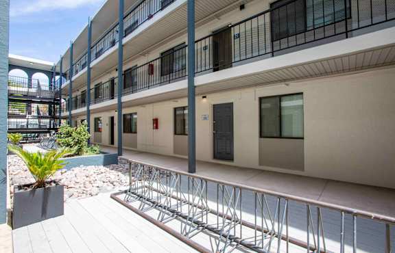 A building with a balcony and a bike rack