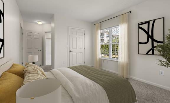 A bedroom with a large bed and a window with curtains.