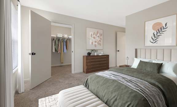 A bedroom with a large bed and a wooden dresser.