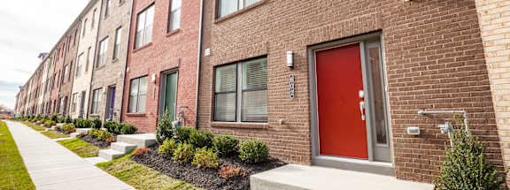 Apartment Building with Red Doors at Refinery Row in Baltimore, MD, 21224