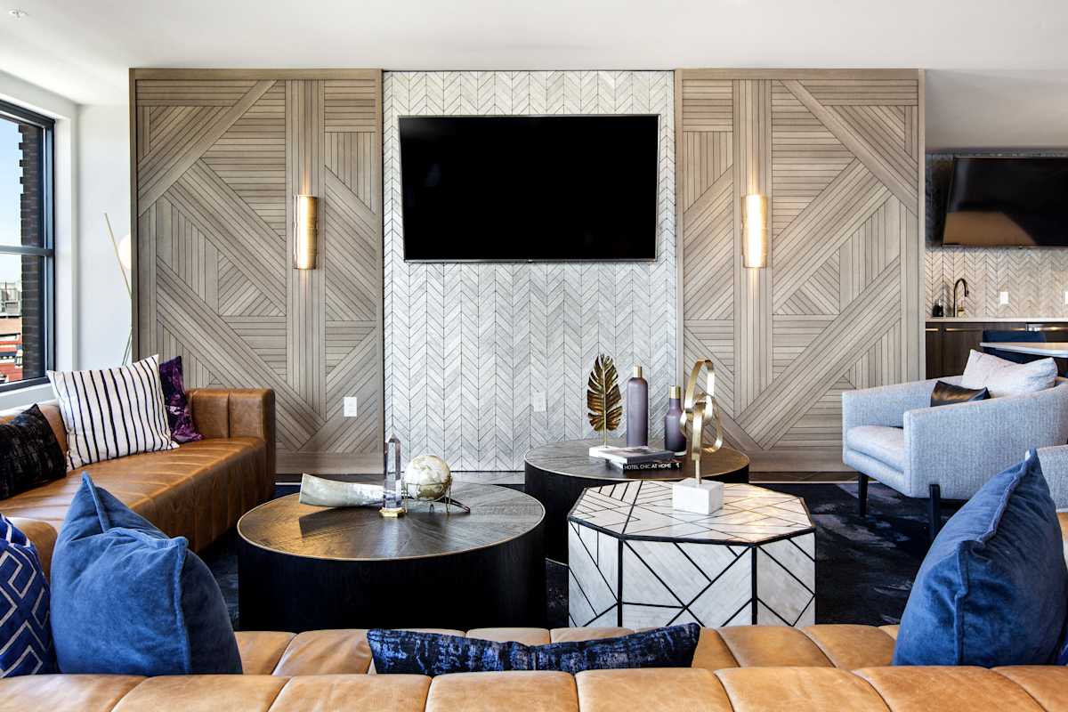 The Lydian resident lounge with seating and TV - Denver, CO