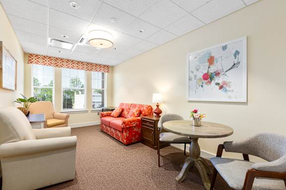 a living room with furniture and a table