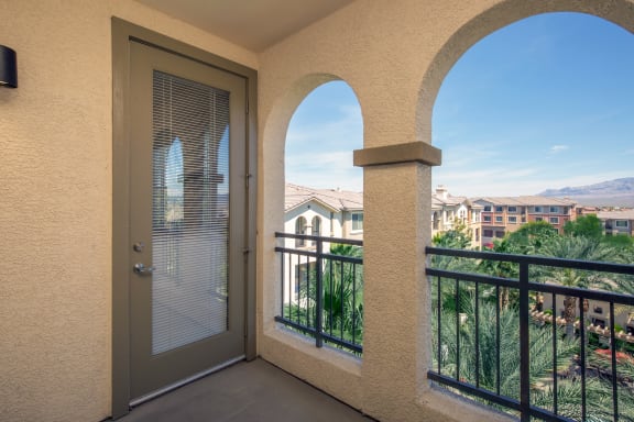a balcony with a door and a view of the city at Loreto & Palacio Apartments, Nevada