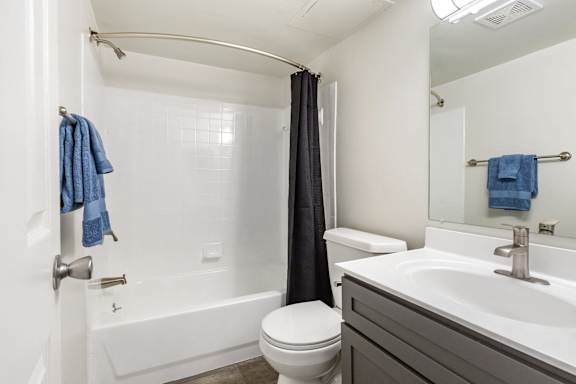 a bathroom with a sink toilet and a shower at Copper and Quarry Village, Pikesville, Maryland