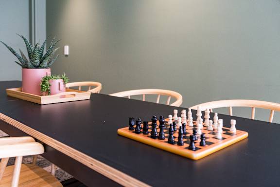 a chess board on a table in a dining room