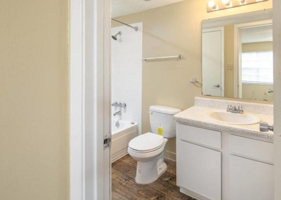 a bathroom with a toilet sink and bathtub