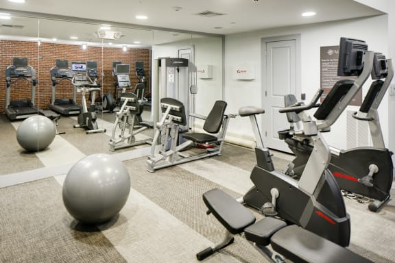 a room filled with lots of different types of exercise equipment